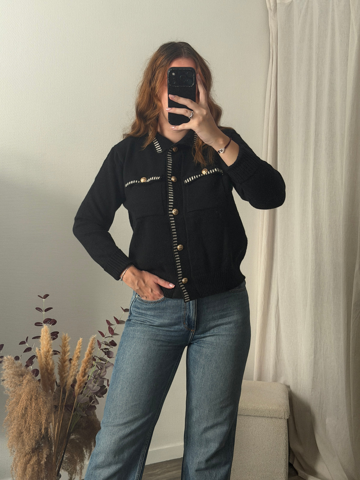 Gilet noir coutures blanches