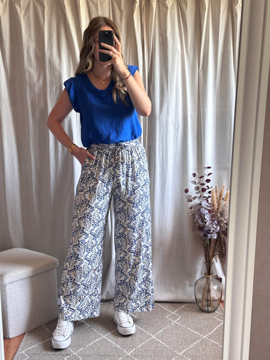 Pantalon fluide bleu à motif